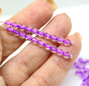 4mm Crystal clear czech glass beads, purple pink holes, fire polished - 50Pc