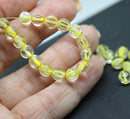 6mm Crystal clear czech glass melon shape beads, yellow colored holes - 30pc