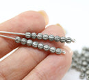 3mm Heavy silver wash black melon shape glass beads, 4gr