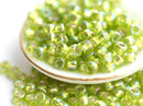8/0 Toho seed beads, Silver Lined Rainbow Lime Green N 2024 - 10g
