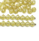 6mm Fancy small bicone beads light yellow silver wash 50Pc