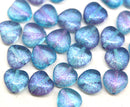 Blue and purple heart-shaped beads on a white background