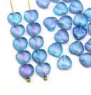 Blue and purple heart-shaped beads on a white background
