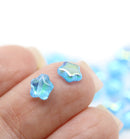 6mm Light Blue Czech glass star beads AB finish 25pc