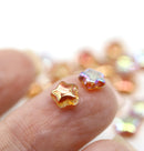 6mm Peach Czech glass star beads AB finish 25pc