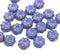 Blue czech glass beads with copper accents on a white background