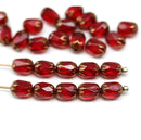 6x4mm Dark red rice czech glass fire polished small oval beads golden ends 25pc