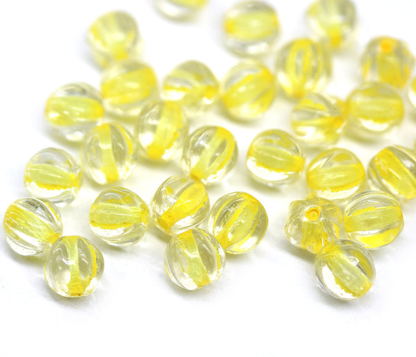 6mm Crystal clear czech glass melon shape beads, yellow colored holes - 30pc