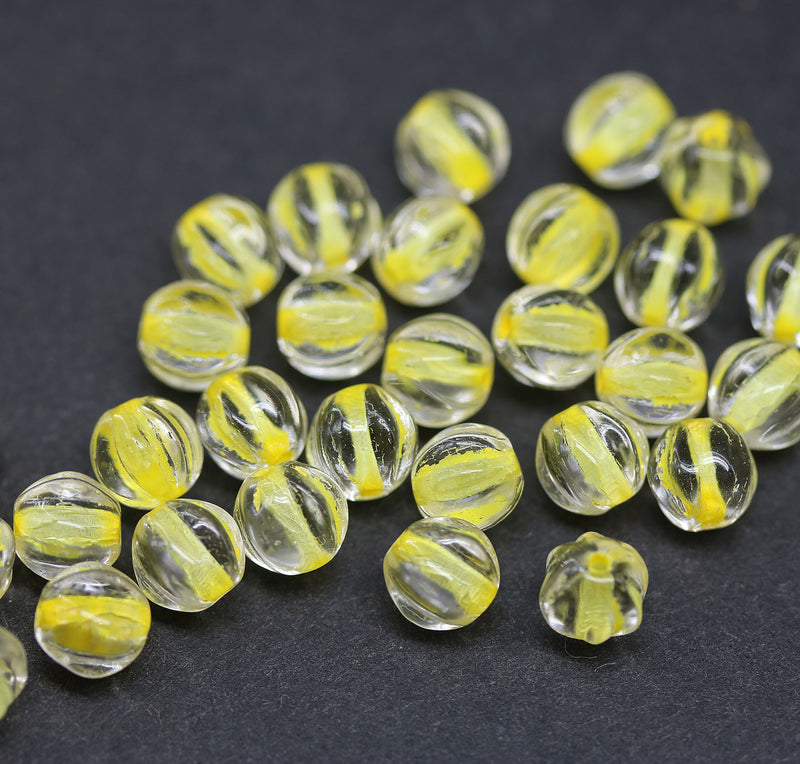 6mm Crystal clear czech glass melon shape beads, yellow colored holes - 30pc