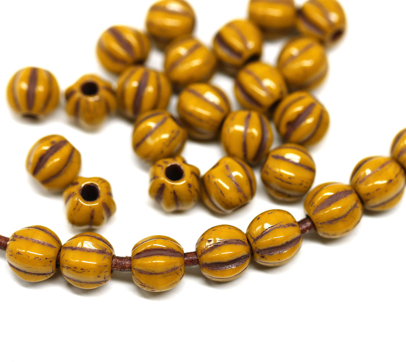 1.5mm hole Ocher yellow 6mm melon shape beads - 30pc