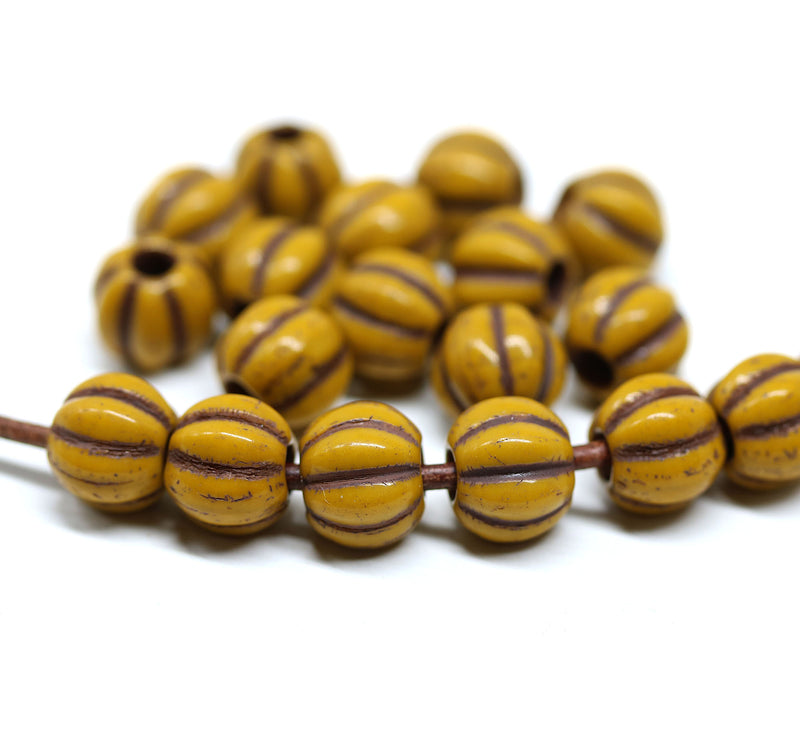 2.5mm hole Ocher yellow 8mm melon shape beads - 20pc