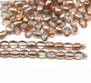 4x3mm Clear czech glass rice oval beads, copper coating - about 150pc