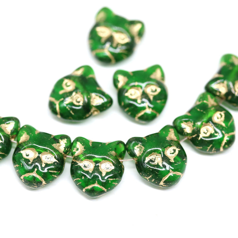 Emerald green cat head beads, golden inlays Czech glass feline beads