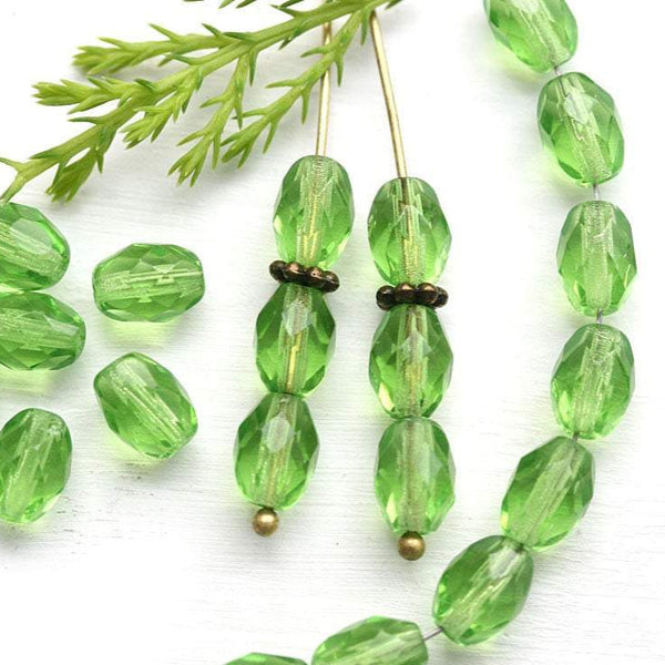 8x6mm Transparent Green barrel beads, czech glass fire polished - 30Pc