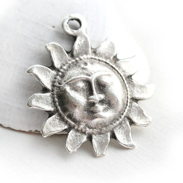 Antique silver celestial sun pendant