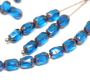 6x4mm Capri blue czech glass fire polished rice beads gold ends 25pc