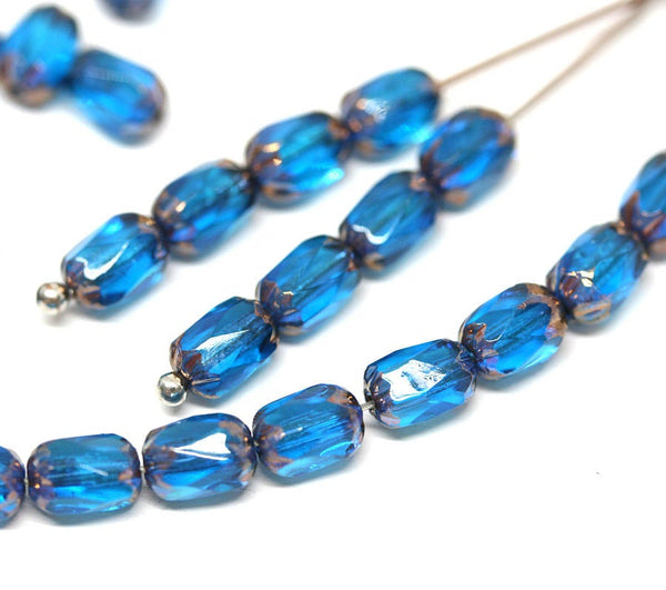 6x4mm Capri blue czech glass fire polished rice beads gold ends 25pc