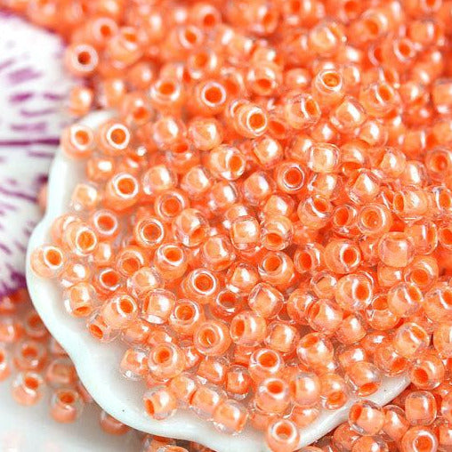 11/0 Toho Seed beads, Inside Color Crystal Salmon Lined N 985, orange rocailles - 10g