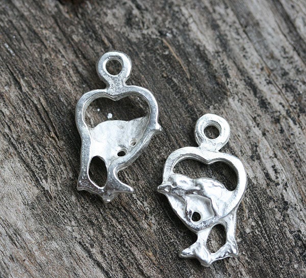 2pc Silver tone Dolphins in heart charm