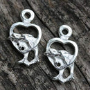 2pc Silver tone Dolphins in heart charm