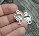 2pc Silver tone Dolphins in heart charm